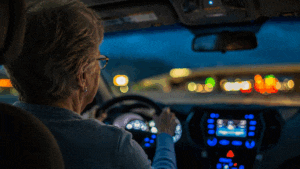 Senior woman having trouble seeing at night while driving, she needs to learn how to prepare for cataract surgery at M&M Eye Institute