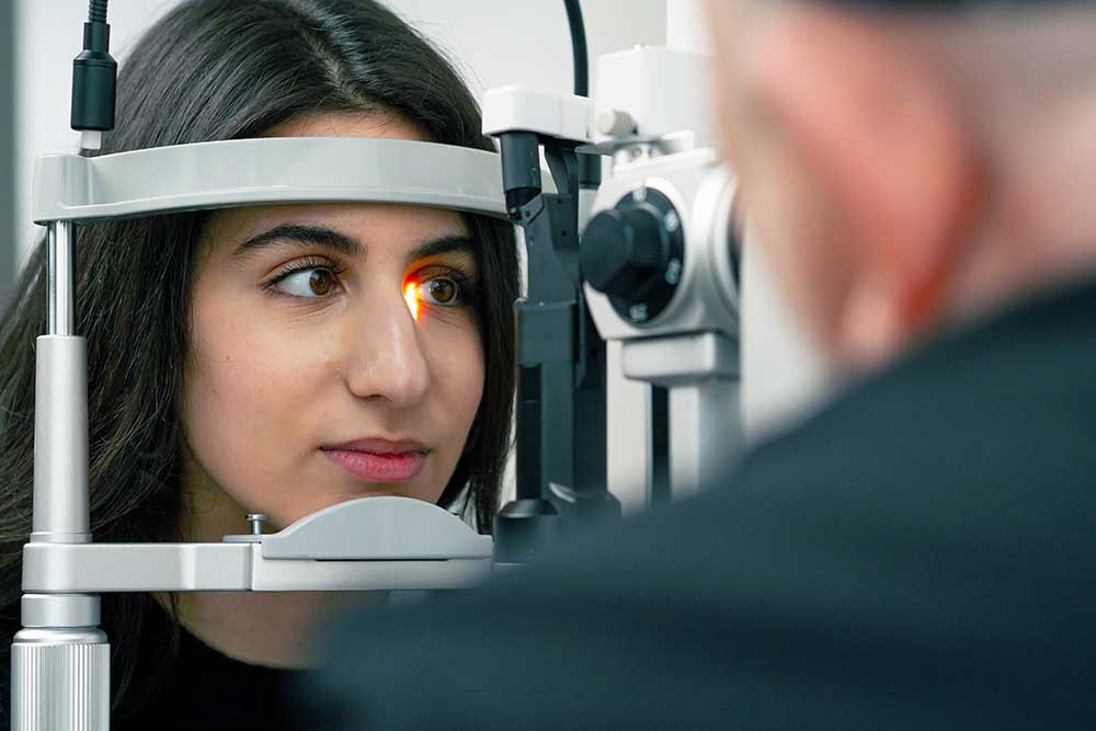 Patient having comprehensive eye exam done.